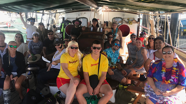 a group of people around each other