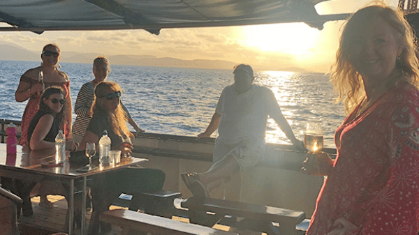 a group of people standing around a plane