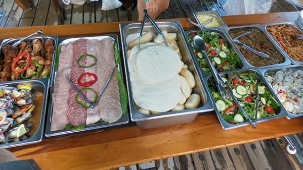 Solway Lass – Lunch served on top deck a bunch of food on a table