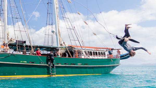 Solway Lass – Tarzan Rope Swing a small boat in a body of water