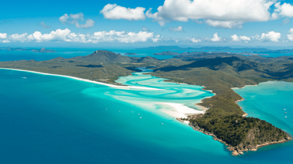Solway Lass – Whitehaven Beach Aerial a view of water and a mountain in the background