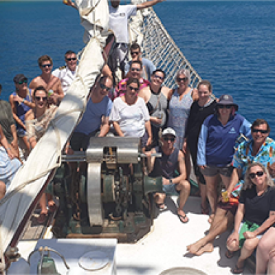 a group of people on a boat in the water