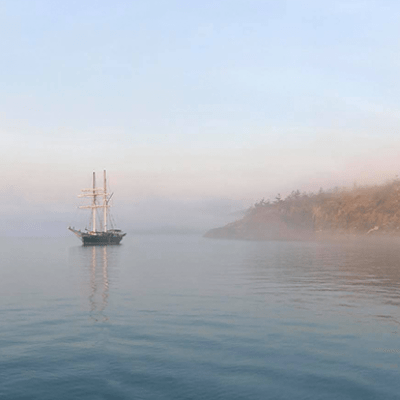 a small boat in a large body of water