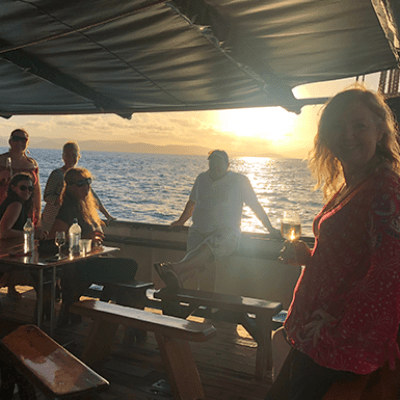 a group of people standing around a plane