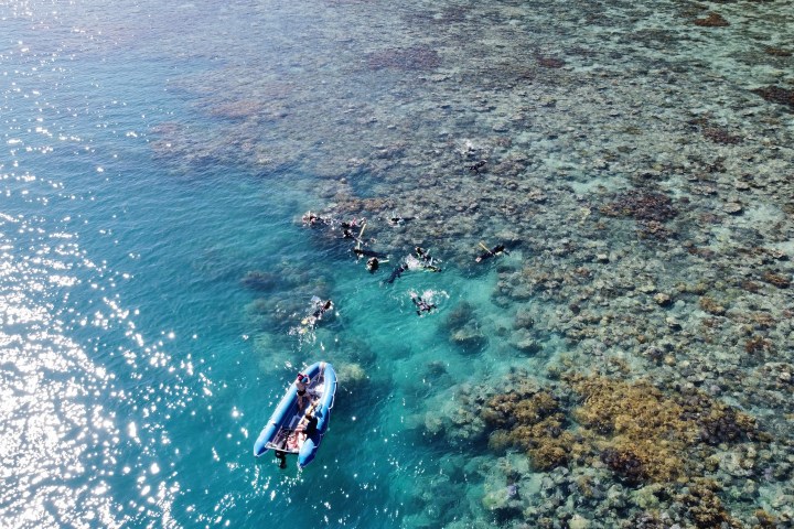 a man riding a wave on top of a body of water