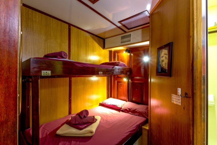 a bedroom with a bed in a room