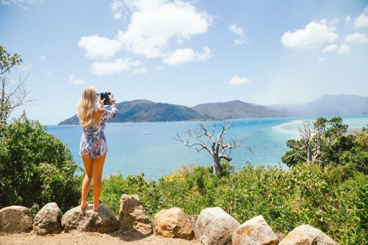 a person standing in front of a body of water