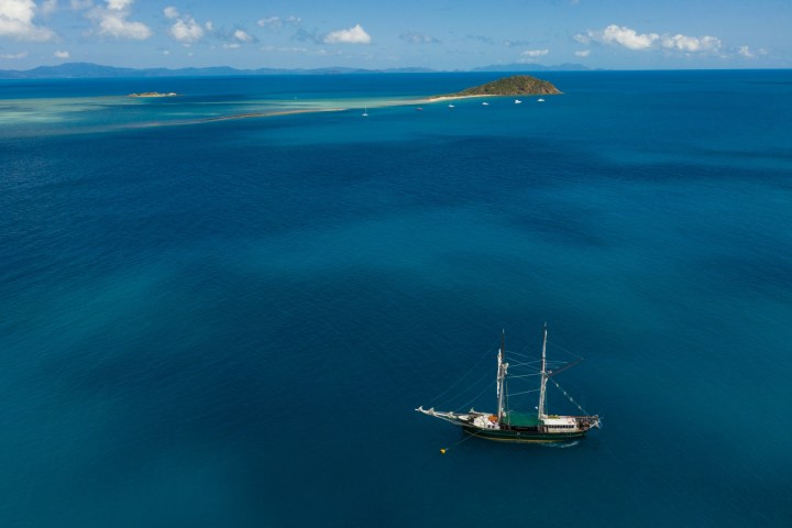 a small boat in a large body of water
