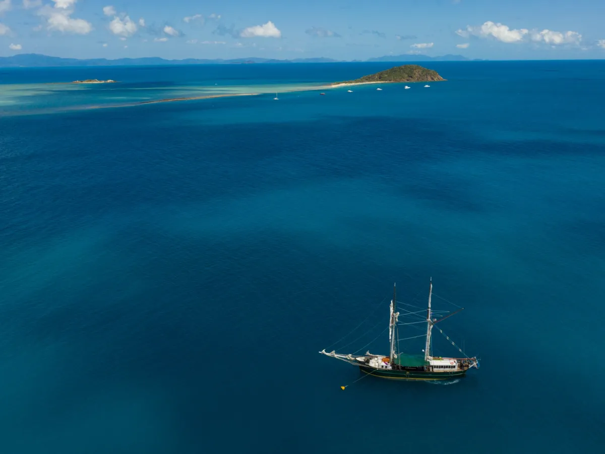 a small boat in a large body of water