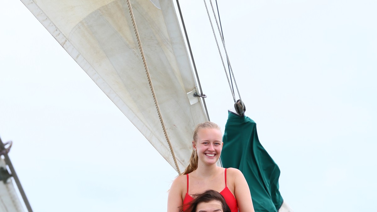 a person riding on the back of a boat